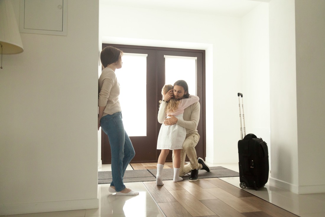 Father Leaving, Hugging Daughter